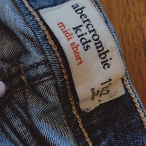 dark wash jean shorts with small rips